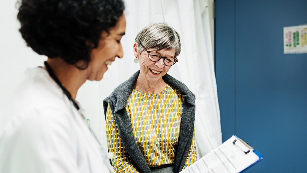 older woman speaking with her doctor