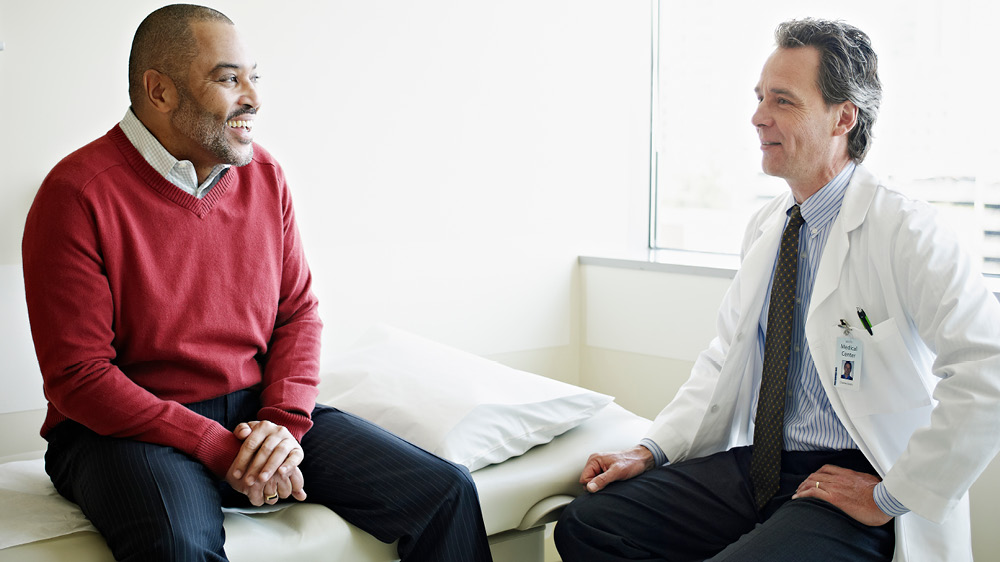 mature man consulting with doctor 