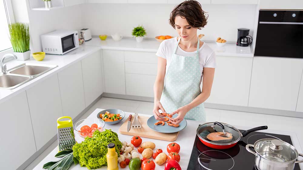 woman cooking keto dinner