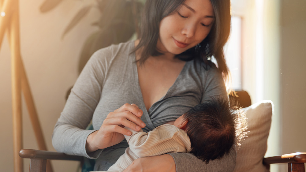 Woman breastfeeding baby