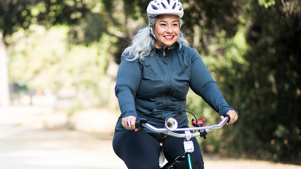 older woman riding on bike