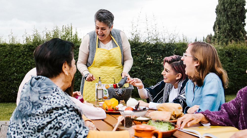 hispanic multigenerational women eating outside