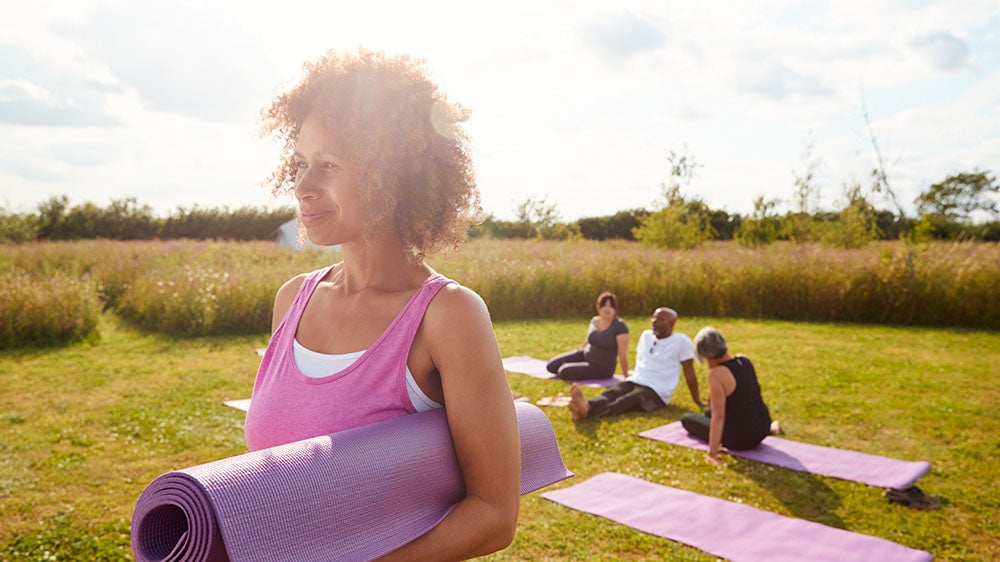 group of people practicing yoga outside