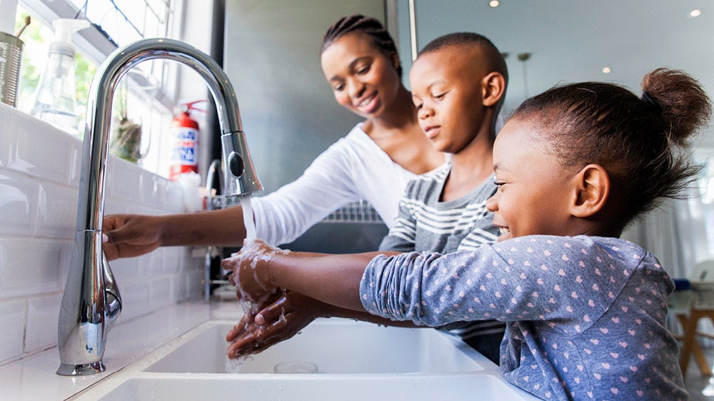 Family washing their hands together