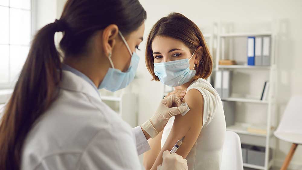 woman receiving vaccination