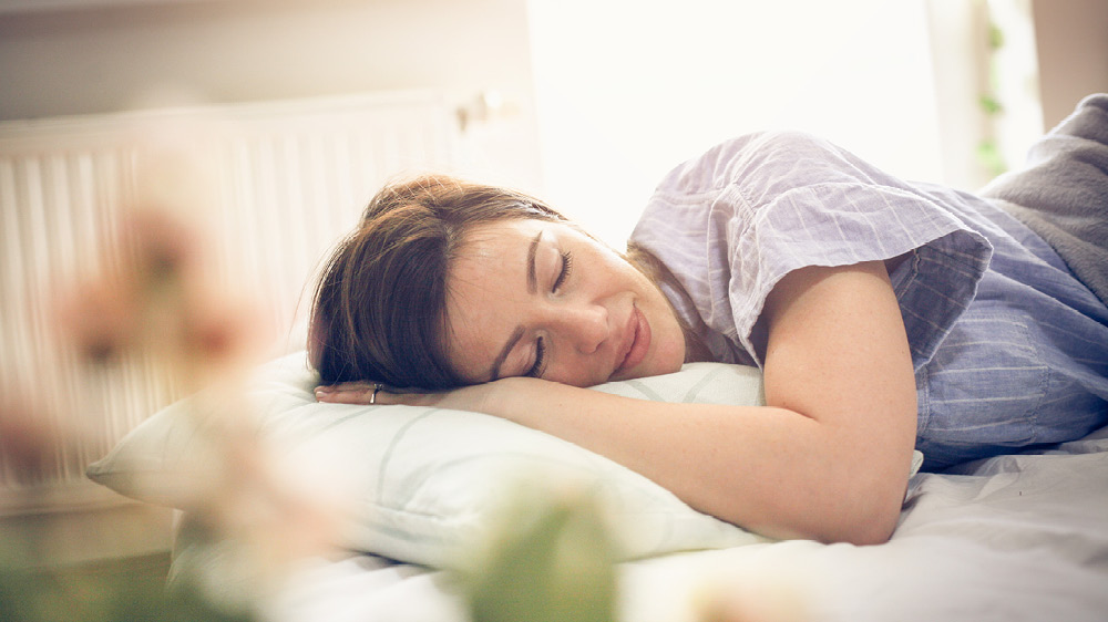 woman sleeping in bright room