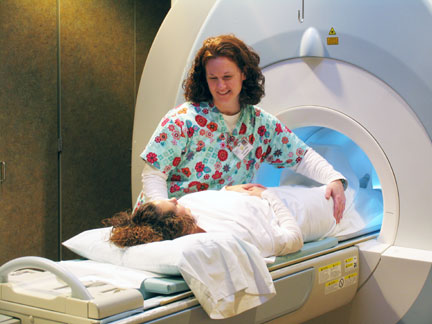 patient and technician at MRI machine