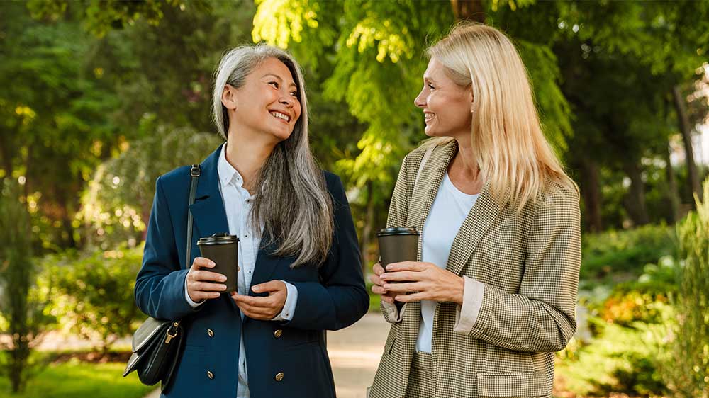 two older women drinking coffee